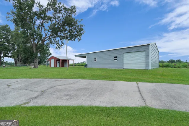 a view of a field with an ocean
