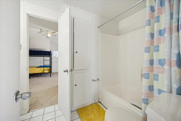 a bathroom with a tub and a shower
