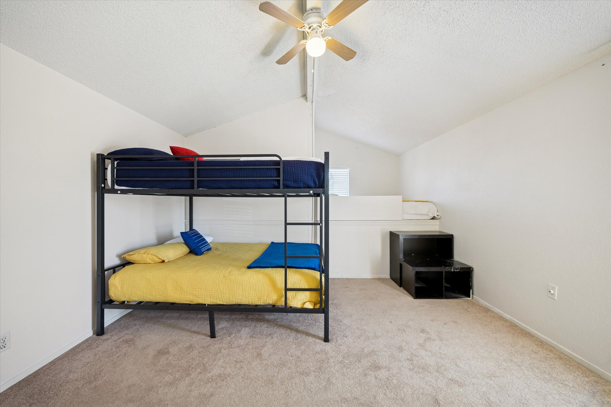 4814 Misty Slope Lane Austin, TX 78744 - Photo 13 of 17 a bedroom with a bed and a table