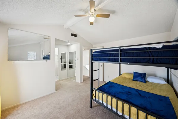 a bedroom with furniture and a chandelier