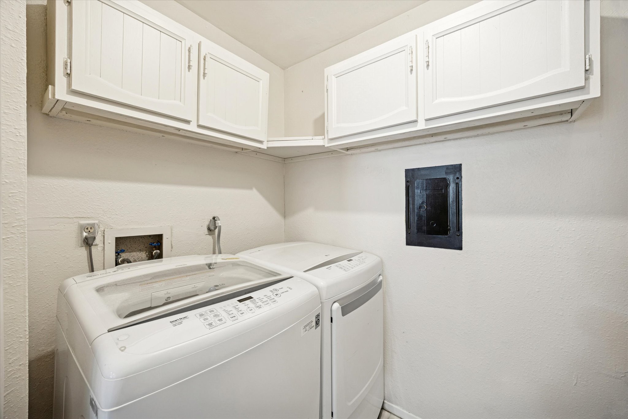 4814 Misty Slope Lane Austin, TX 78744 - Photo 15 of 17 a utility room with dryer and washer