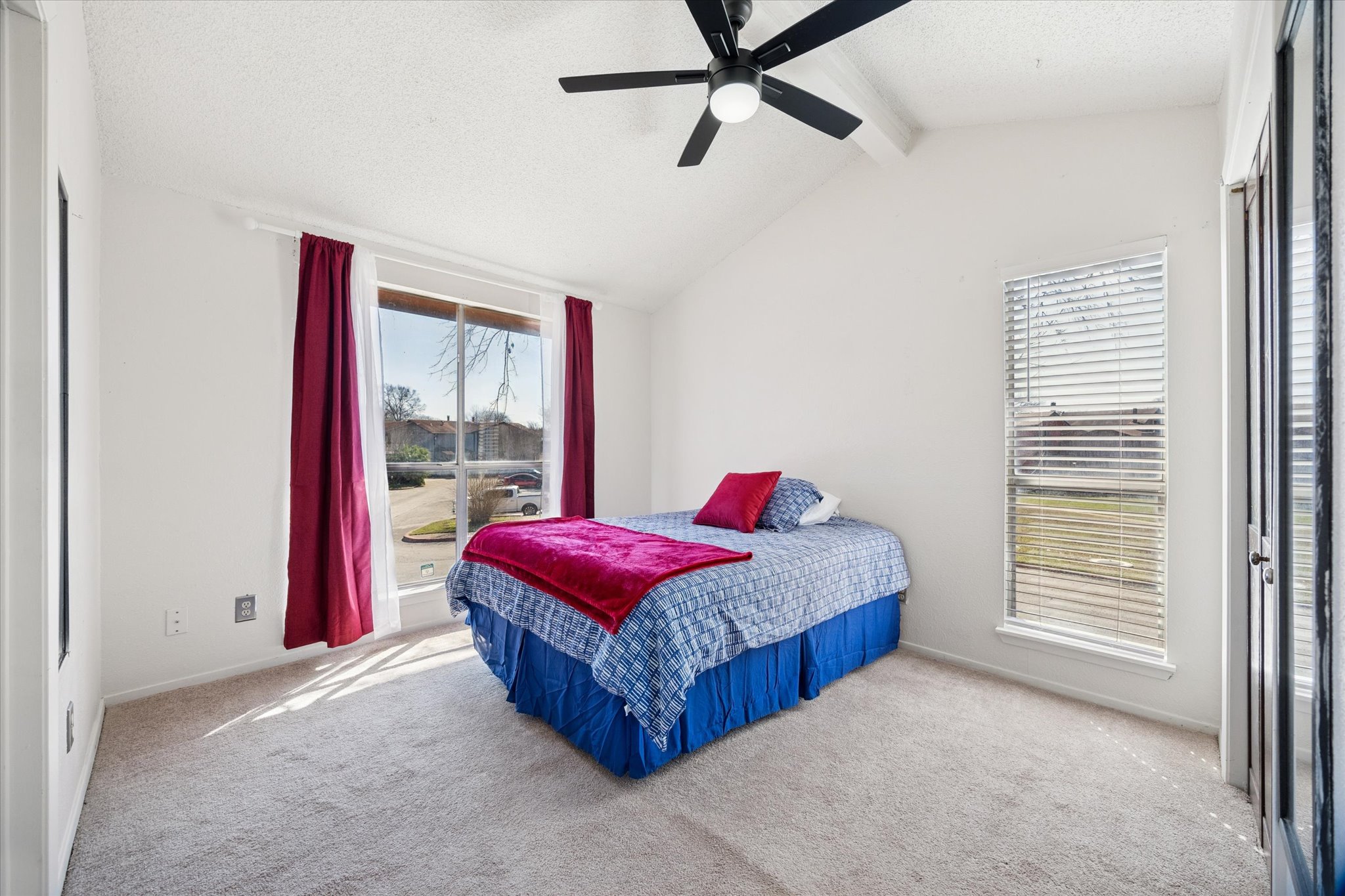 4814 Misty Slope Lane Austin, TX 78744 - Photo 9 of 17 a living room with a bed and a window