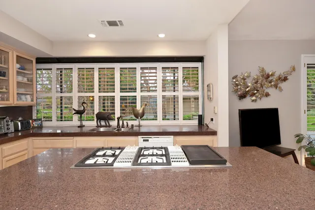 a living room with furniture and a lamp