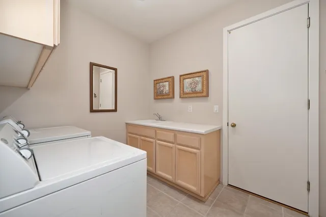 a bed room with a bed and a chair