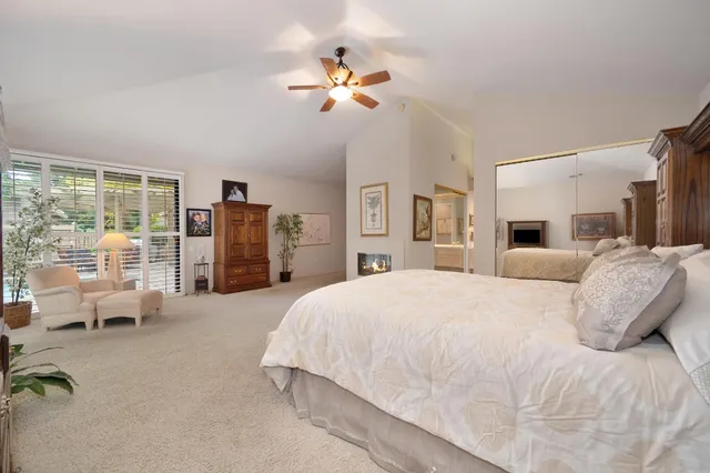a view of a patio with a table chairs and a backyard