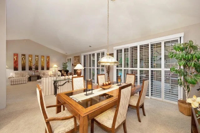 a dining room with furniture and window