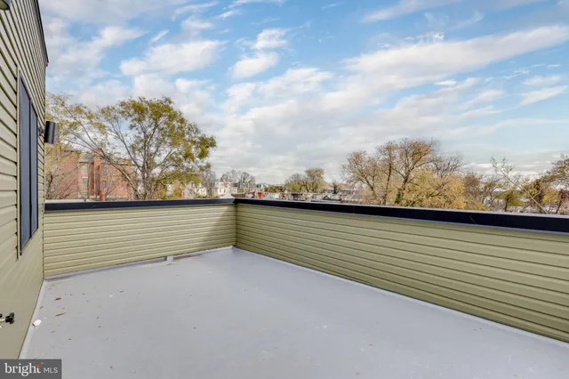 a view of roof deck with mountain and lake view