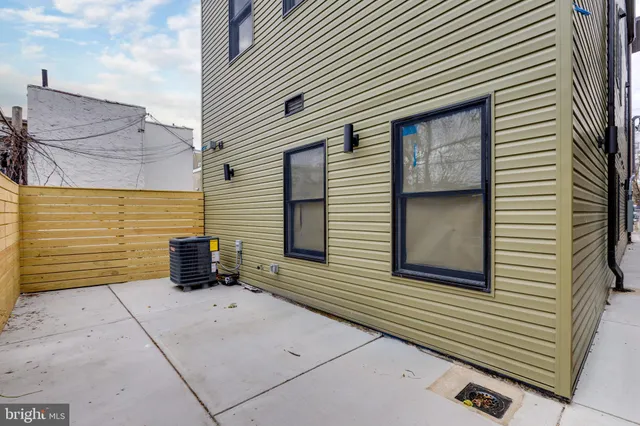 a view of a wooden house with a bench