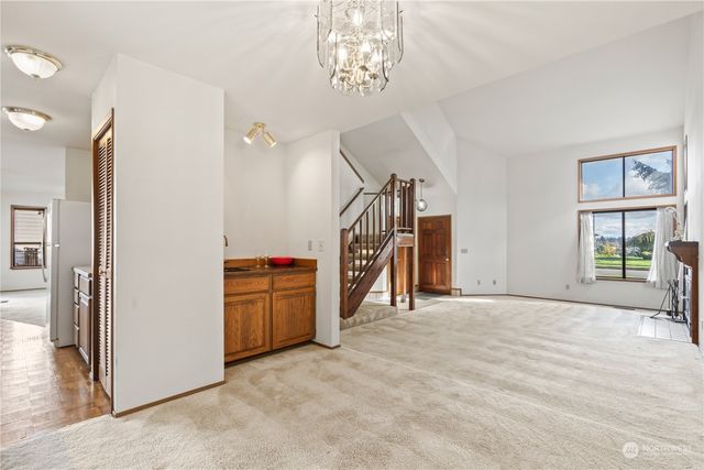 a view of a storage & utility room with closet windows