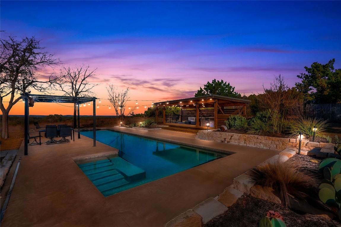 a view of swimming pool outdoor seating