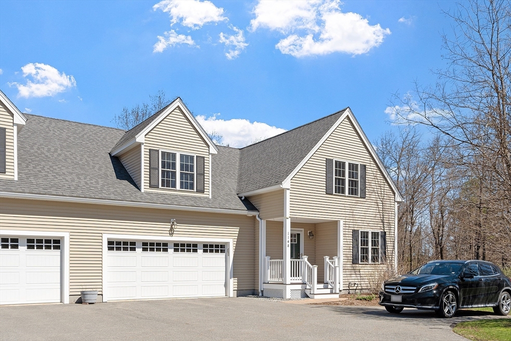 1148 Hill Road, Unit 1148 Boxborough, MA 01719 - Photo 1 of 31 a view of a car park in front of house