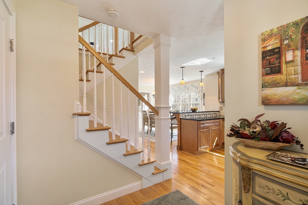 1148 Hill Road, Unit 1148 Boxborough, MA 01719 - Photo 3 of 31 a view of entryway and hall with wooden floor