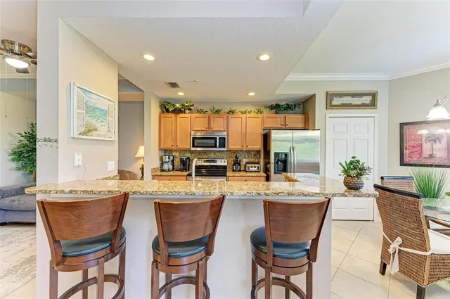 a kitchen with a stove a sink and a microwave