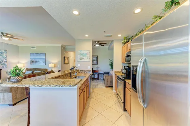 a dining room with furniture potted plants and wooden floor