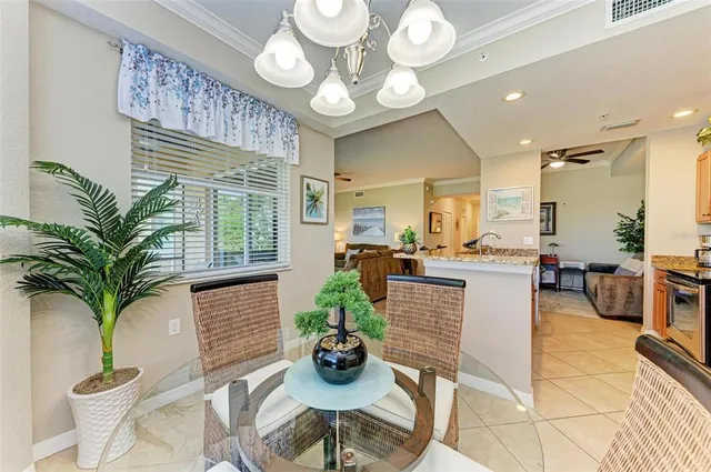 a living room with furniture and a view of kitchen