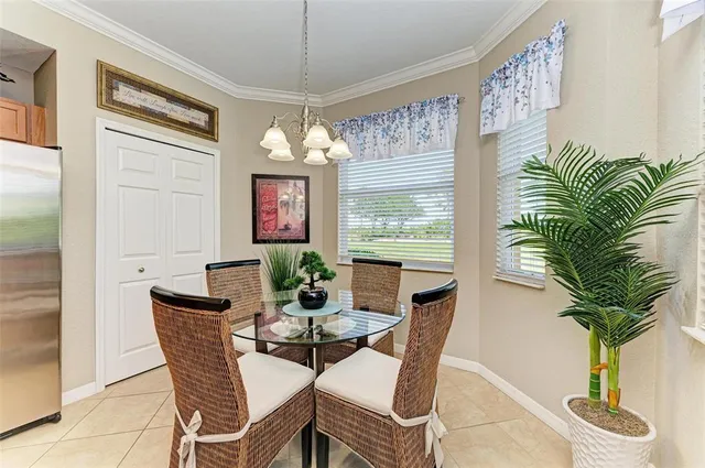 a living room with furniture and a painting on the wall