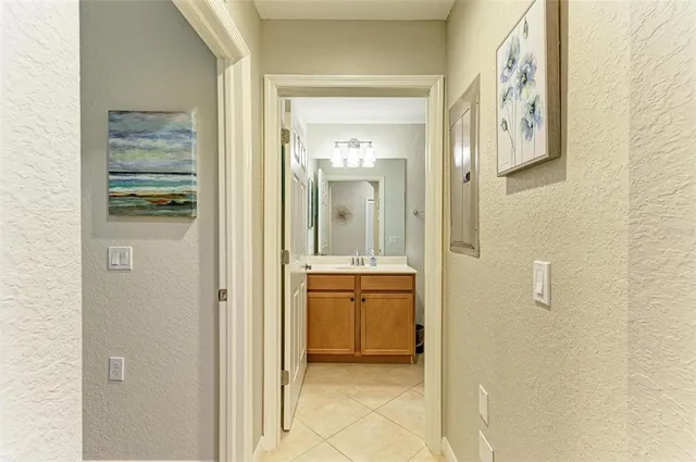 a view of a bathroom with sink mirror and bathtub