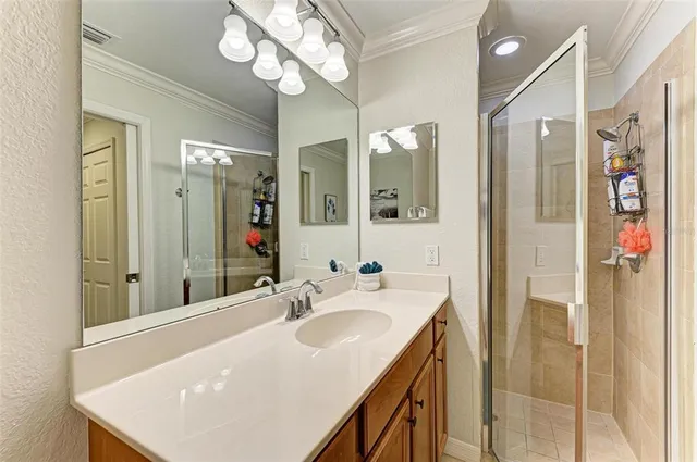 a bedroom with two beds and a painting on the wall