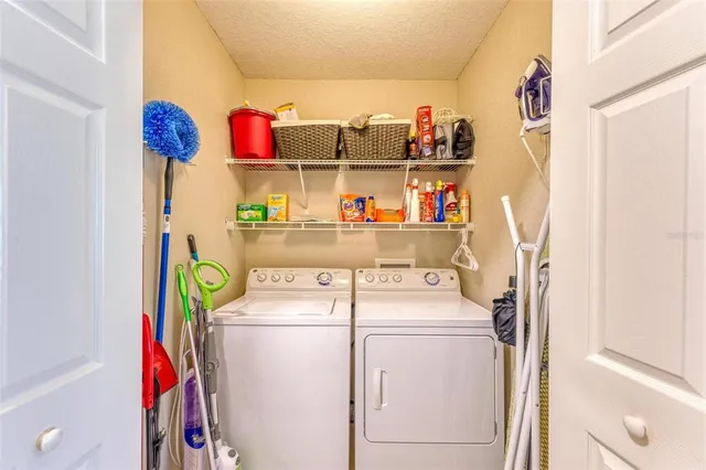 a view of a porch with furniture and wooden floor