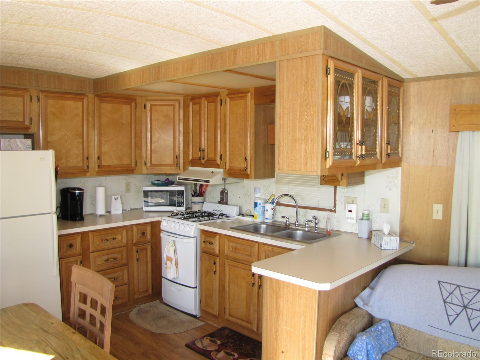 234 Smoke Stack Road Fairplay, CO 80440 - Photo 12 of 19 a kitchen with a sink a stove and cabinets