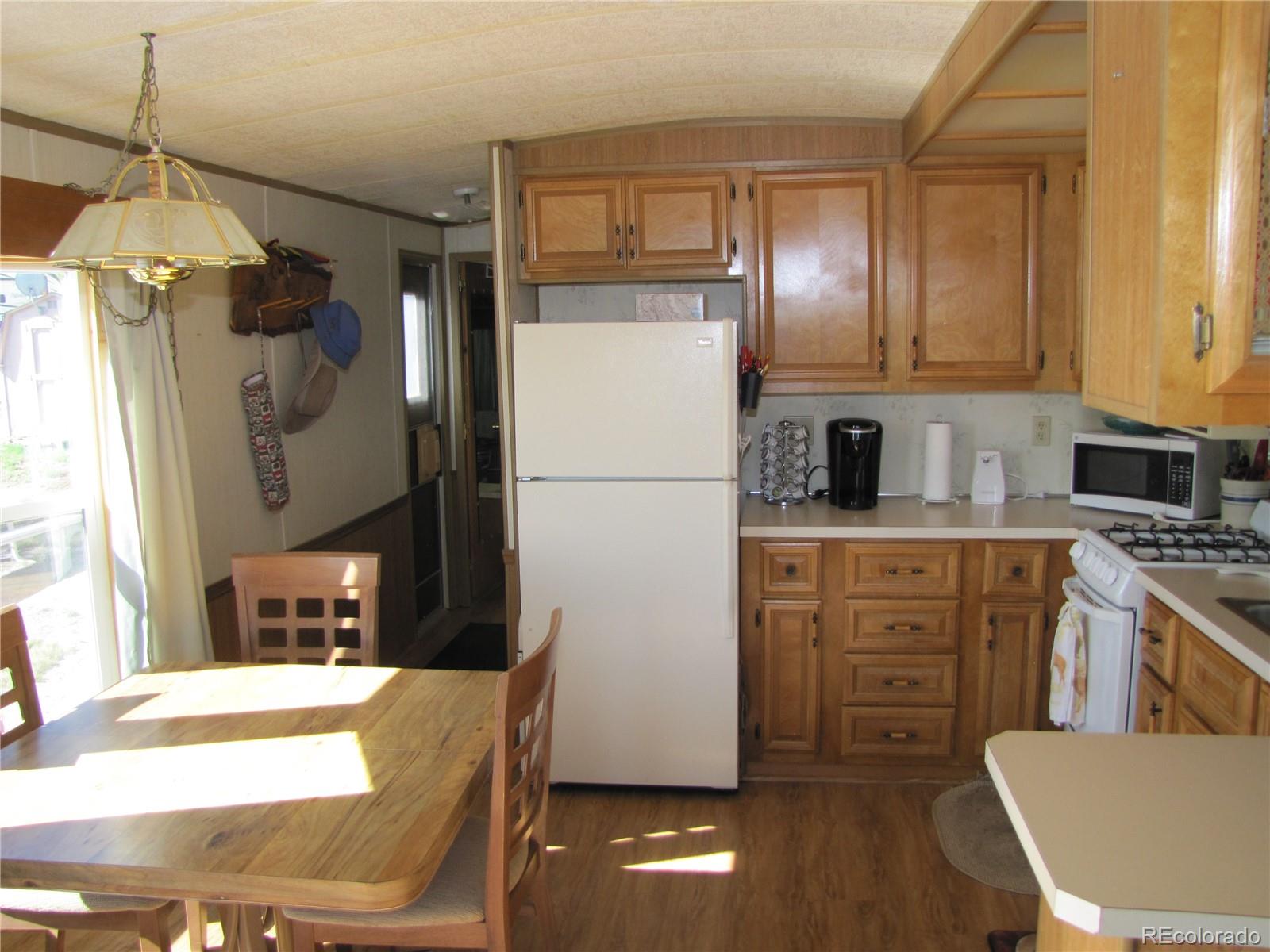 234 Smoke Stack Road Fairplay, CO 80440 - Photo 13 of 19 a kitchen with a refrigerator a stove top oven a sink and dishwasher
