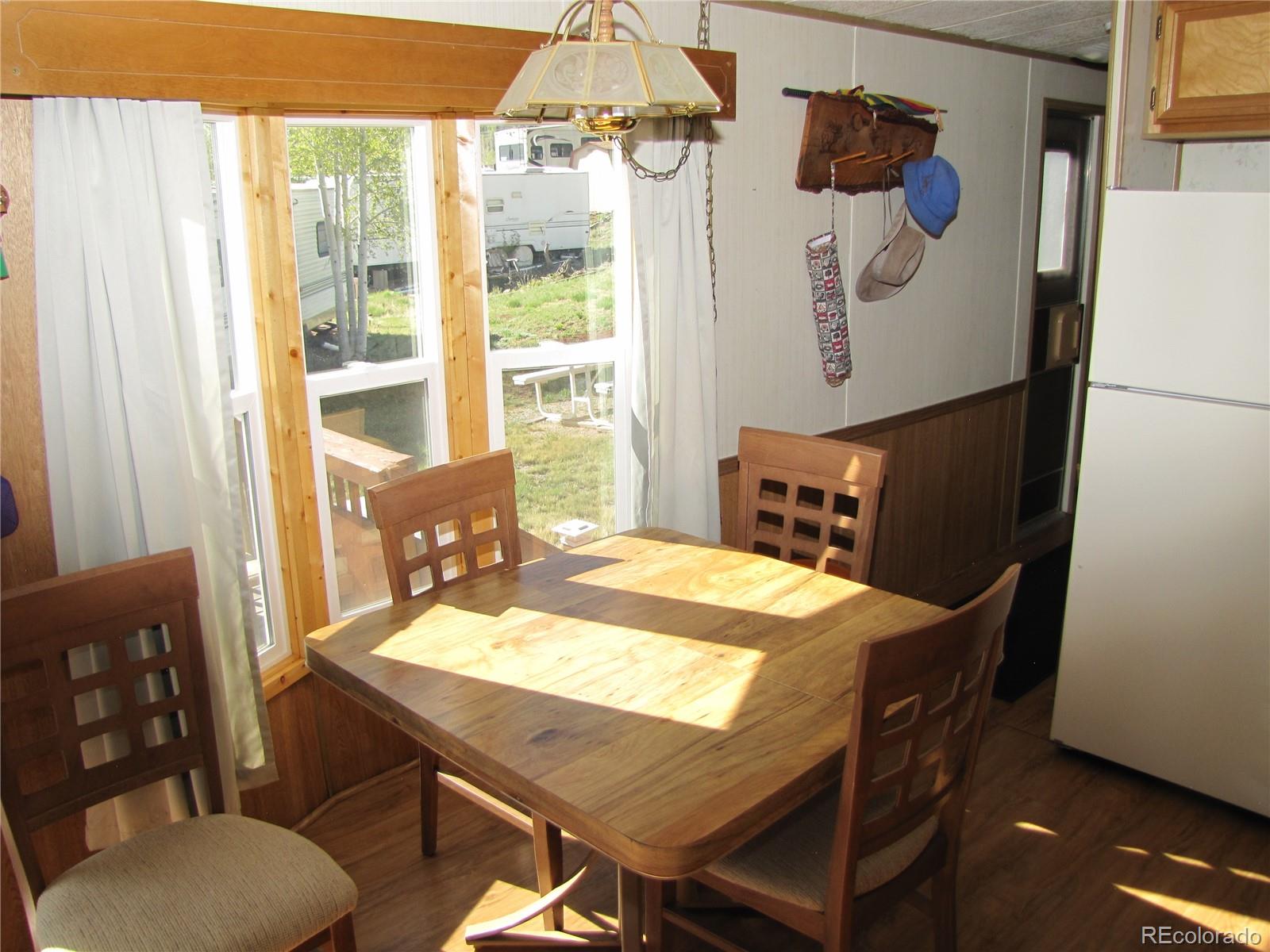 234 Smoke Stack Road Fairplay, CO 80440 - Photo 14 of 19 a view of a dining room with furniture window and outside view