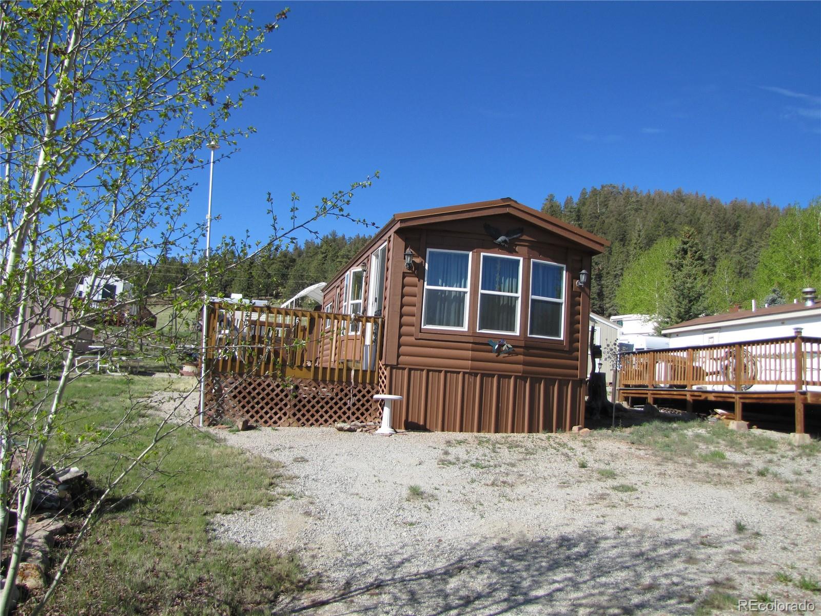234 Smoke Stack Road Fairplay, CO 80440 - Photo 2 of 19 a front view of a house with a yard