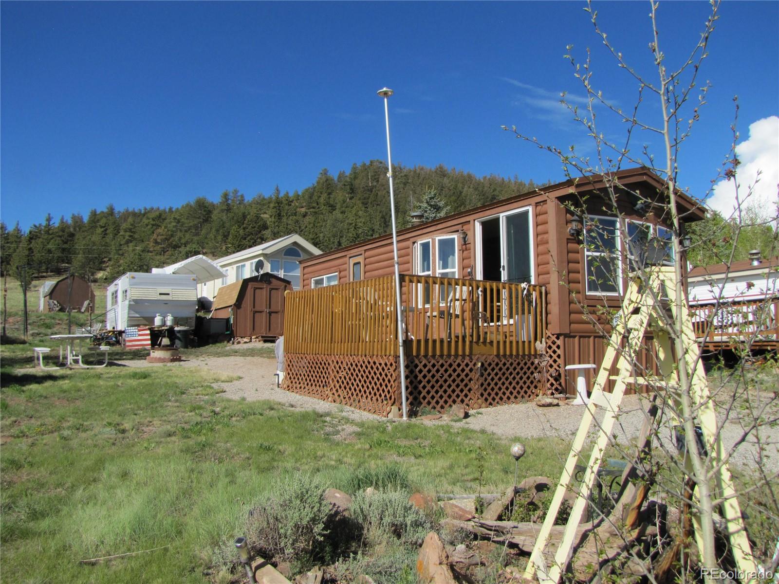 234 Smoke Stack Road Fairplay, CO 80440 - Photo 3 of 19 a front view of a house with a yard