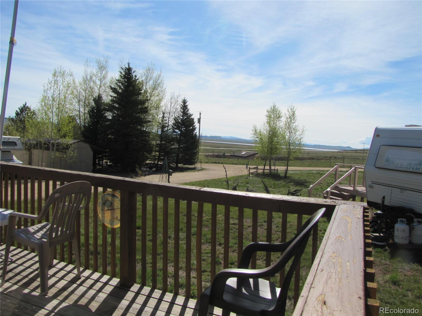 234 Smoke Stack Road Fairplay, CO 80440 - Photo 8 of 19 a view of a balcony with wooden floor and fence