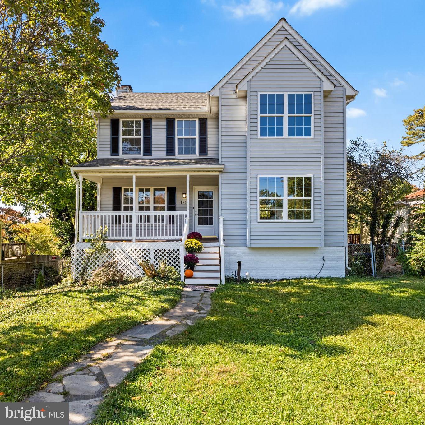 6416 Sherwood Road Baltimore, MD 21239 - Photo 1 of 43 a front view of a house with a yard
