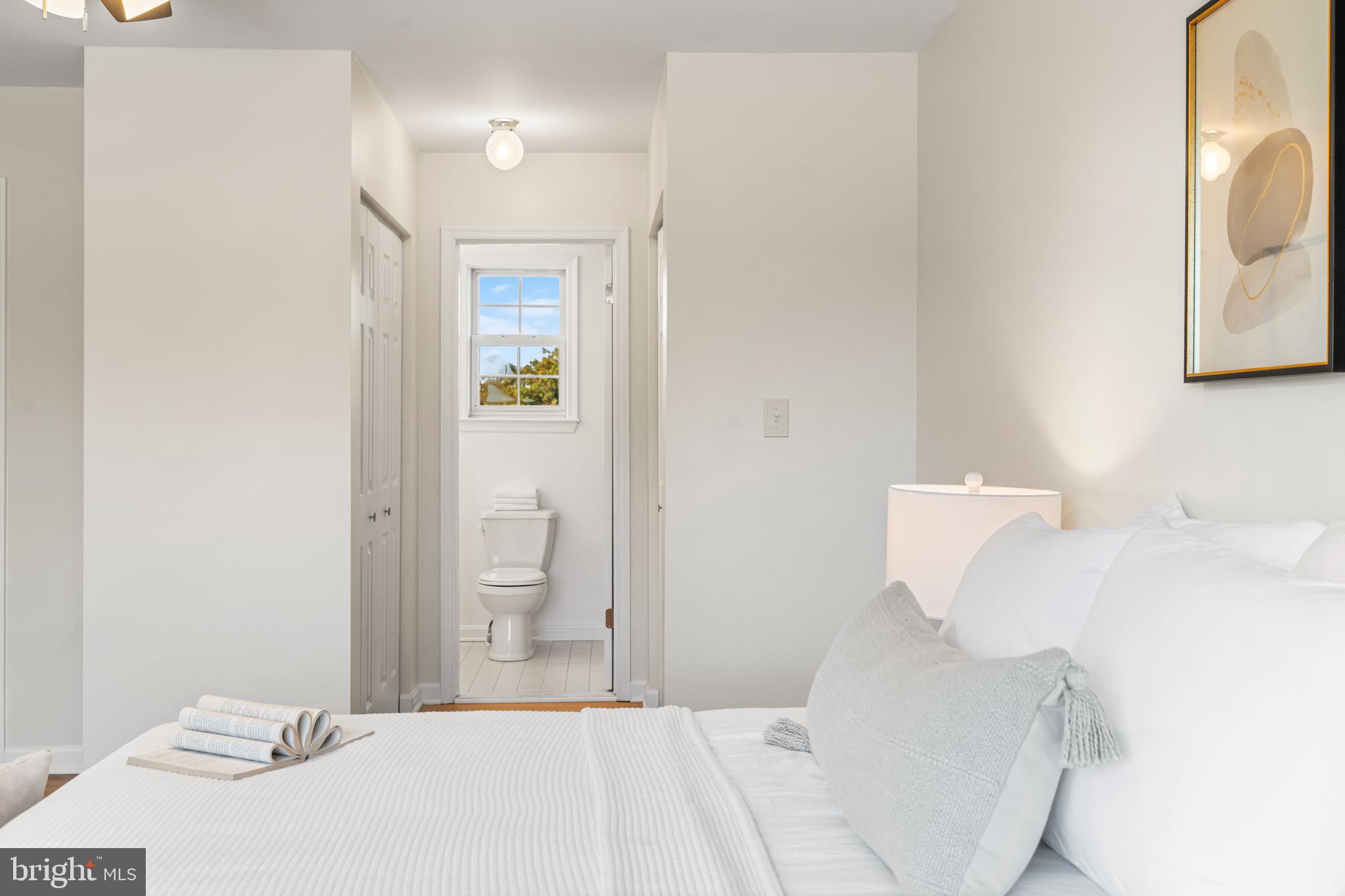 6416 Sherwood Road Baltimore, MD 21239 - Photo 14 of 29 a bedroom with a bed and a painting on the wall