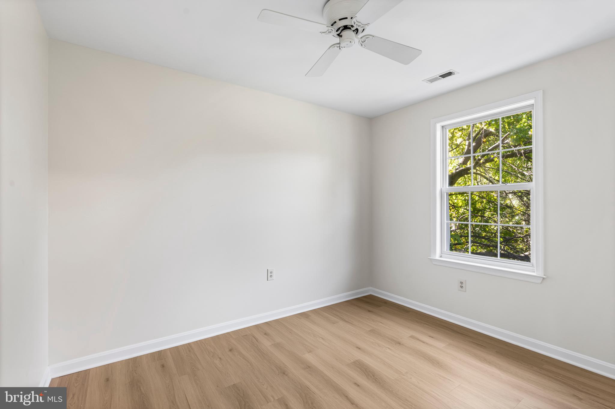 6416 Sherwood Road Baltimore, MD 21239 - Photo 19 of 29 an empty room with a window