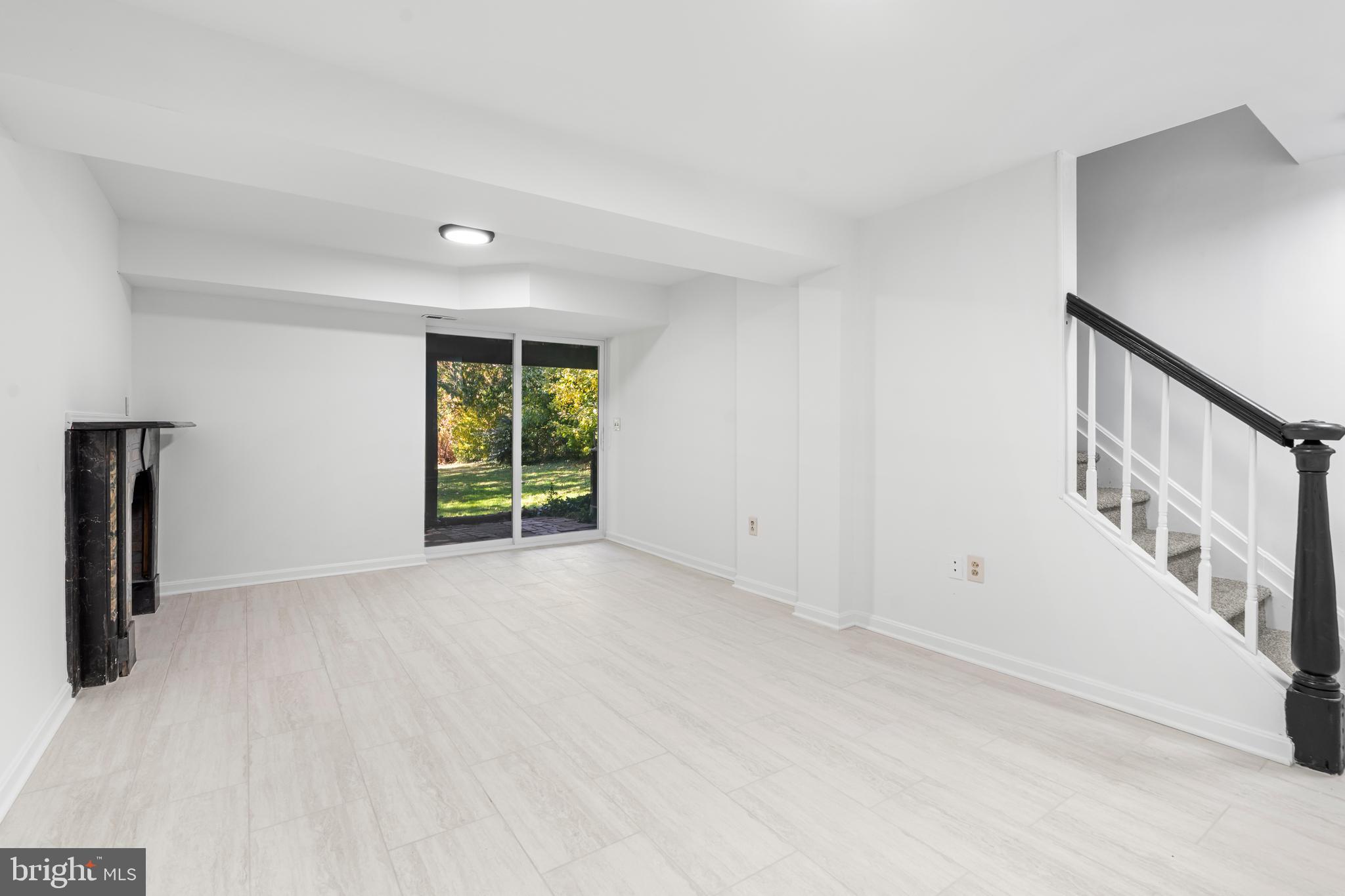 6416 Sherwood Road Baltimore, MD 21239 - Photo 26 of 43 a view of an empty room with a window