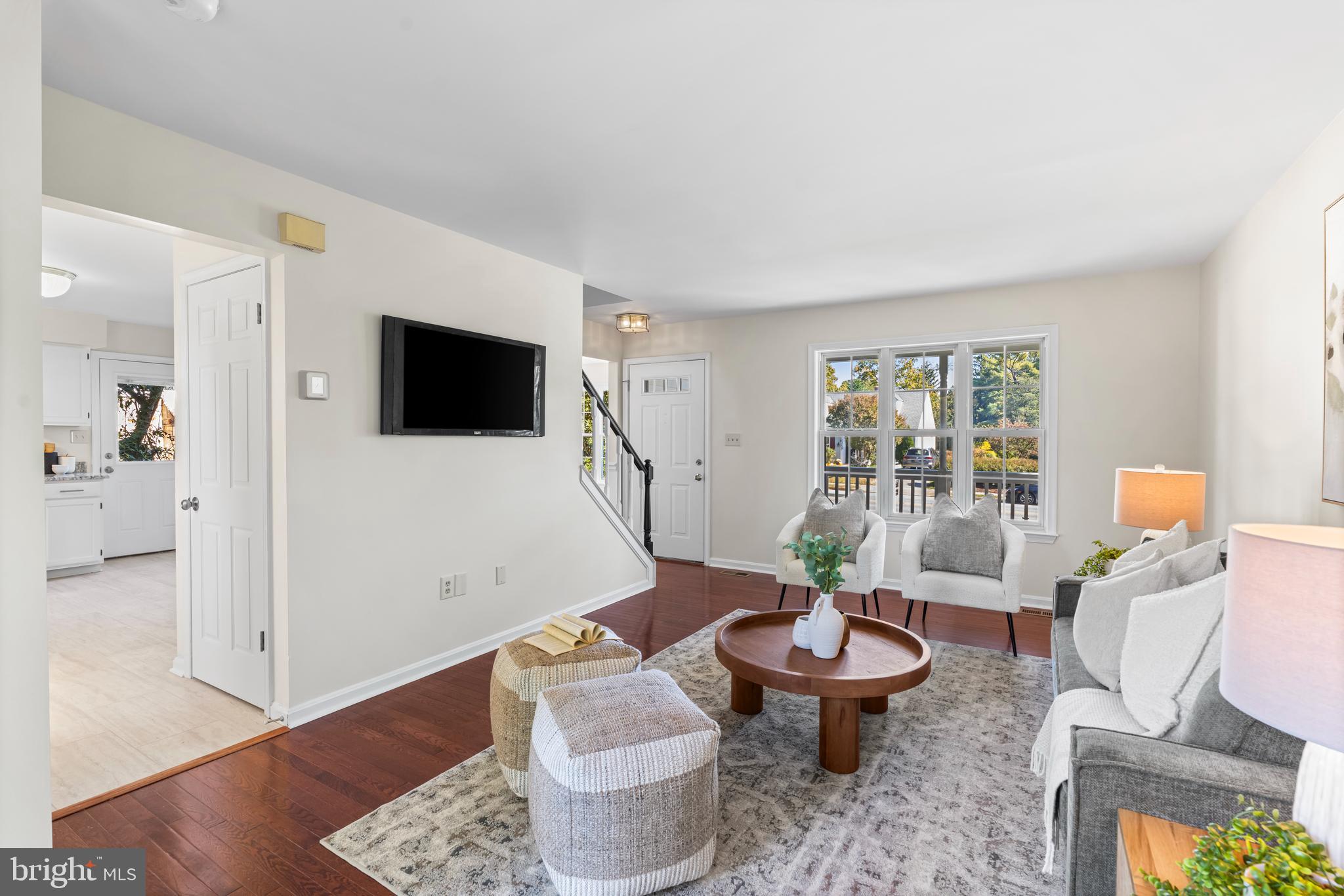 6416 Sherwood Road Baltimore, MD 21239 - Photo 3 of 29 a living room with furniture and a flat screen tv