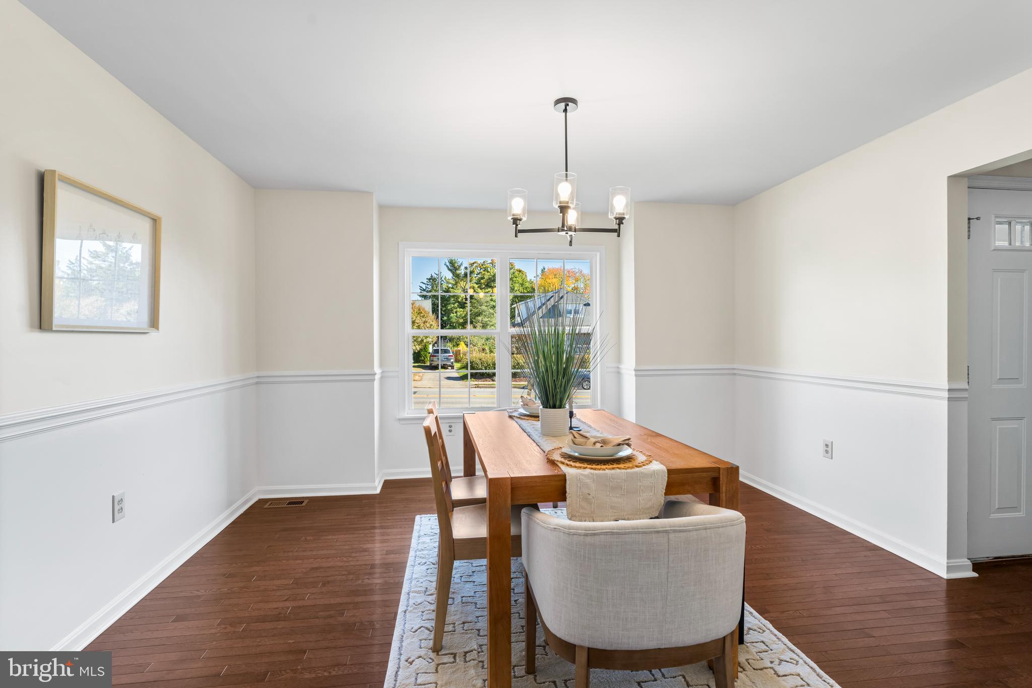 6416 Sherwood Road Baltimore, MD 21239 - Photo 5 of 29 a living room with furniture and a wooden floor