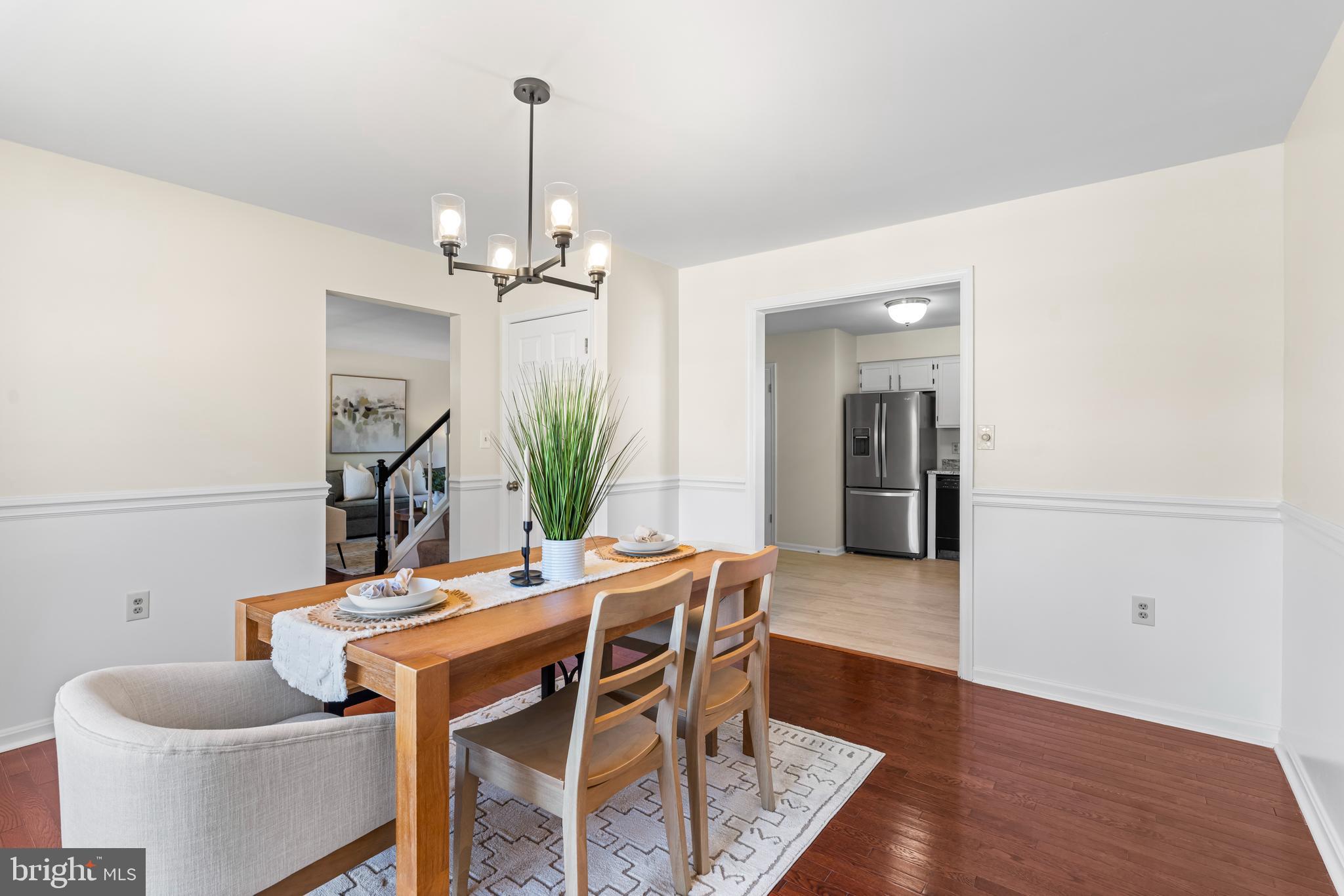 6416 Sherwood Road Baltimore, MD 21239 - Photo 9 of 29 a dining room with furniture and wooden floor