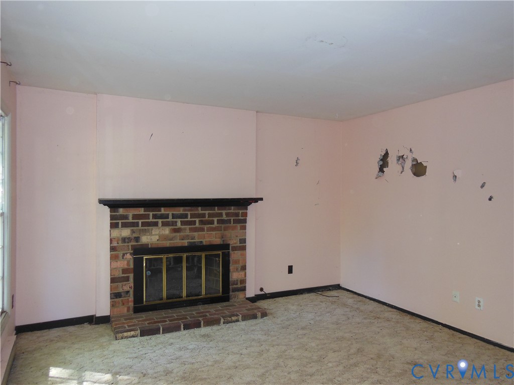10524 Sunne Court Chesterfield, VA 23832 - Photo 7 of 21 a living room with a fireplace