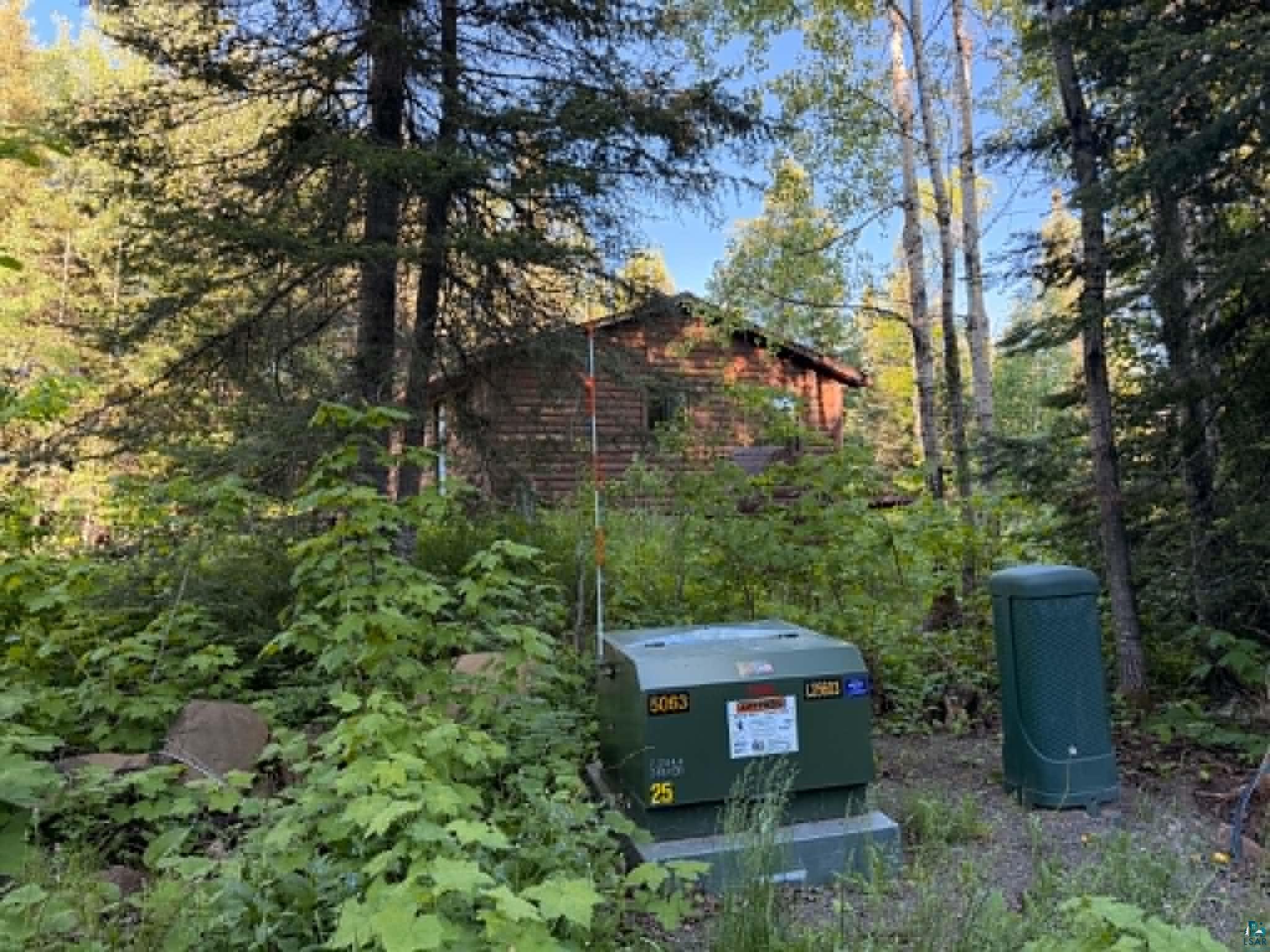 2 X Ary Point Road Hovland, MN 55606 - Photo 21 of 26 Wood-sided structure nestled among mature trees and dense foliage