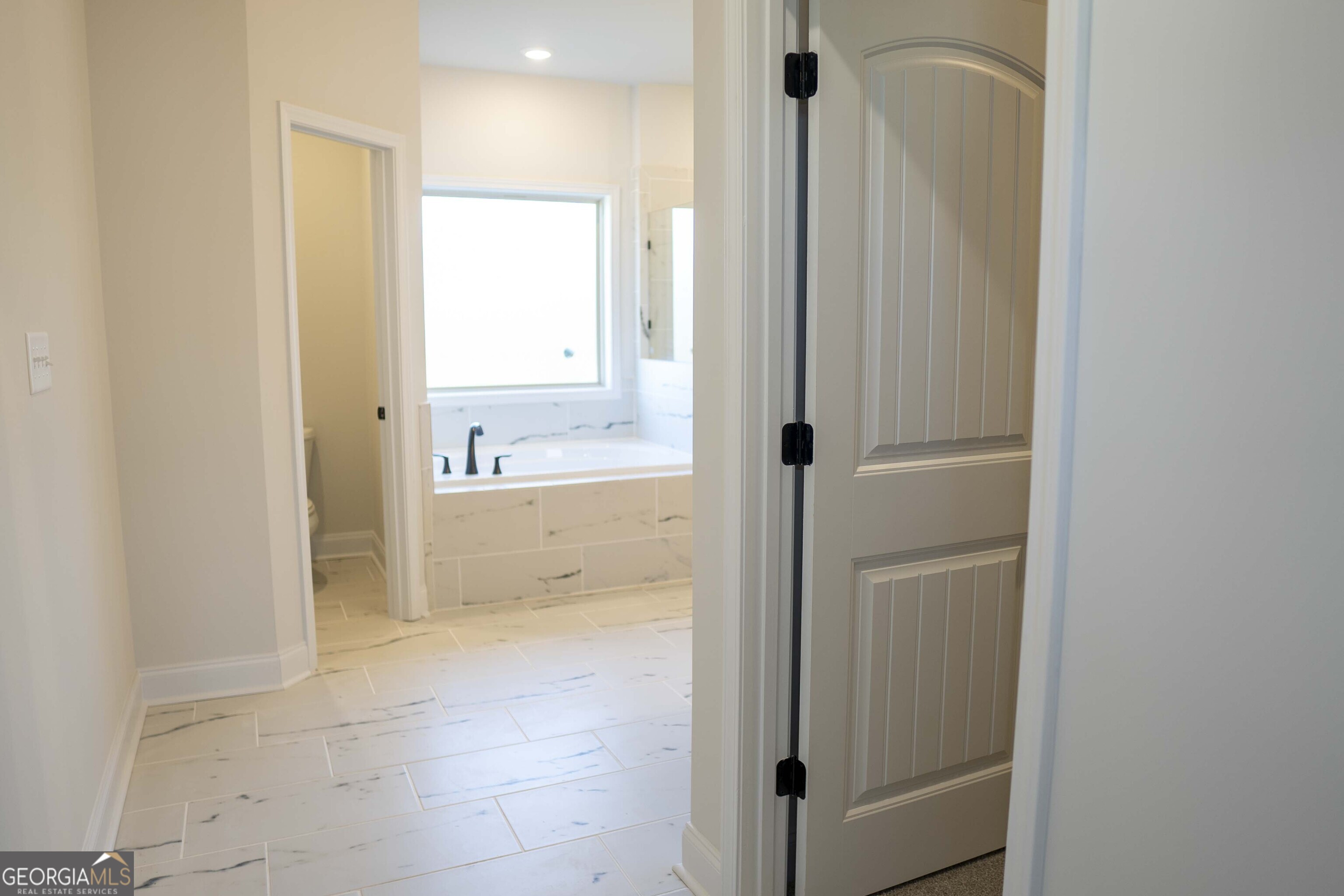 600 Beaver Court Perry, GA 31069 - Photo 32 of 48 a bathroom with a tub shower and sink