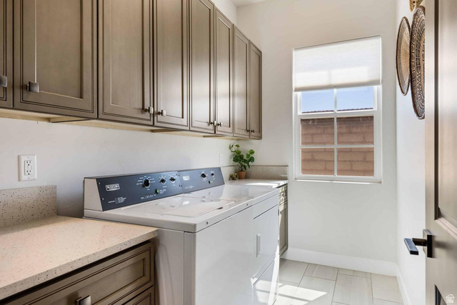 4222 Hampshire Road Hurricane, UT 84737 - Photo 8 of 12 Dedicated laundry space featuring extensive upper cabinetry, light-toned countertops, and a window with a roller shade