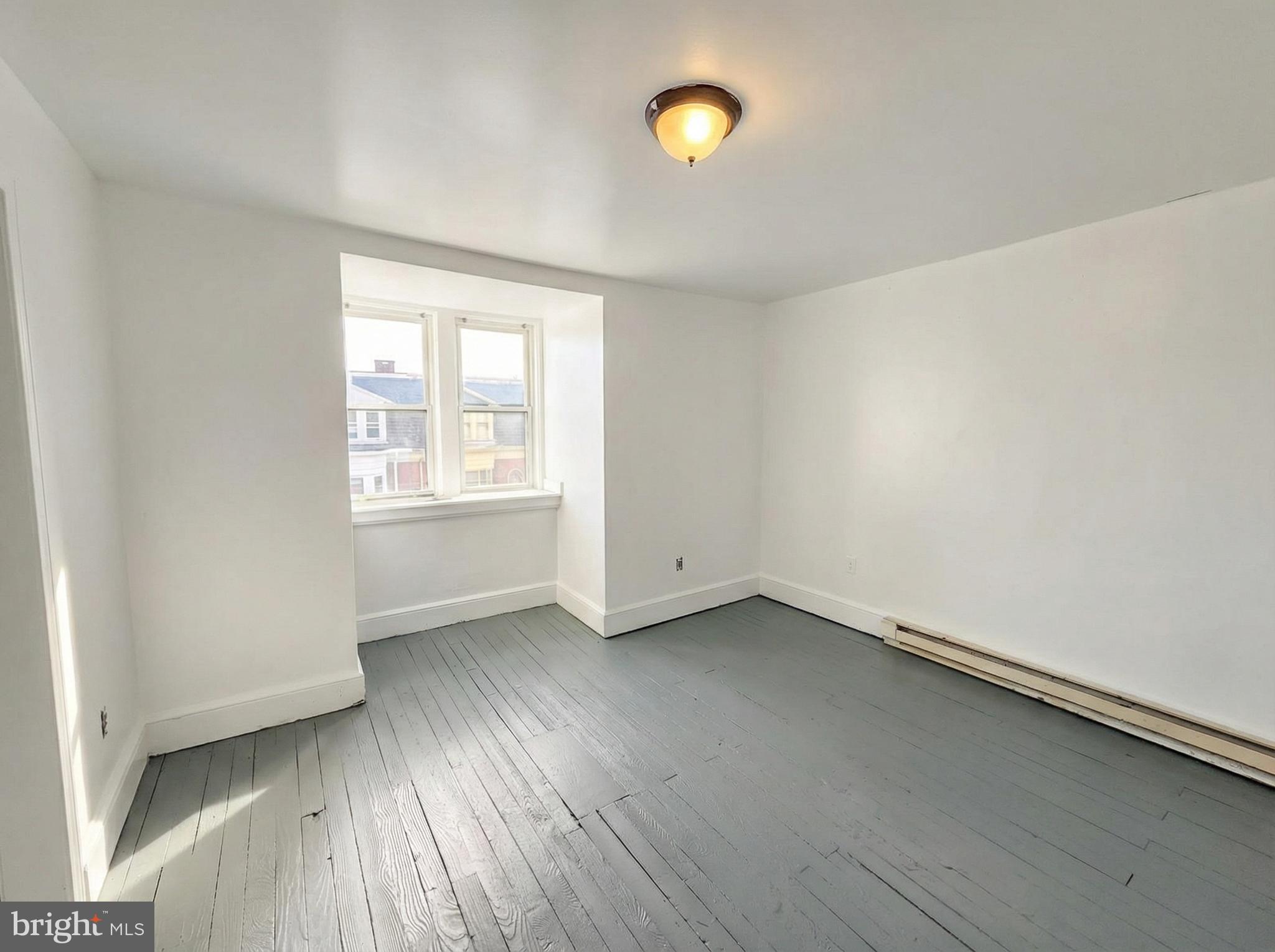 345 East Princess Street York, PA 17403 - Photo 13 of 14 an empty room with wooden floor and windows