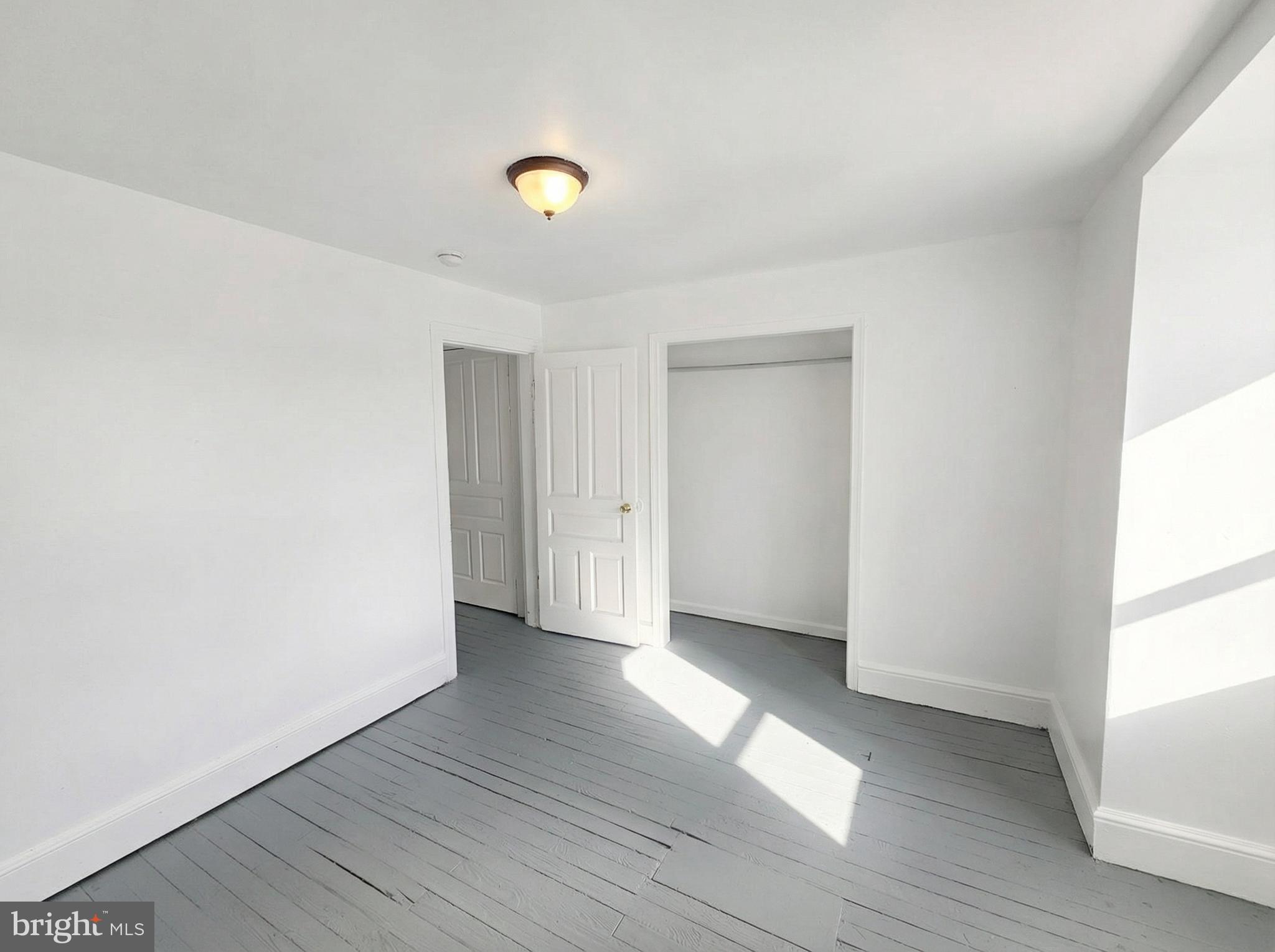 345 East Princess Street York, PA 17403 - Photo 14 of 14 a view of an empty room with wooden floor and a window