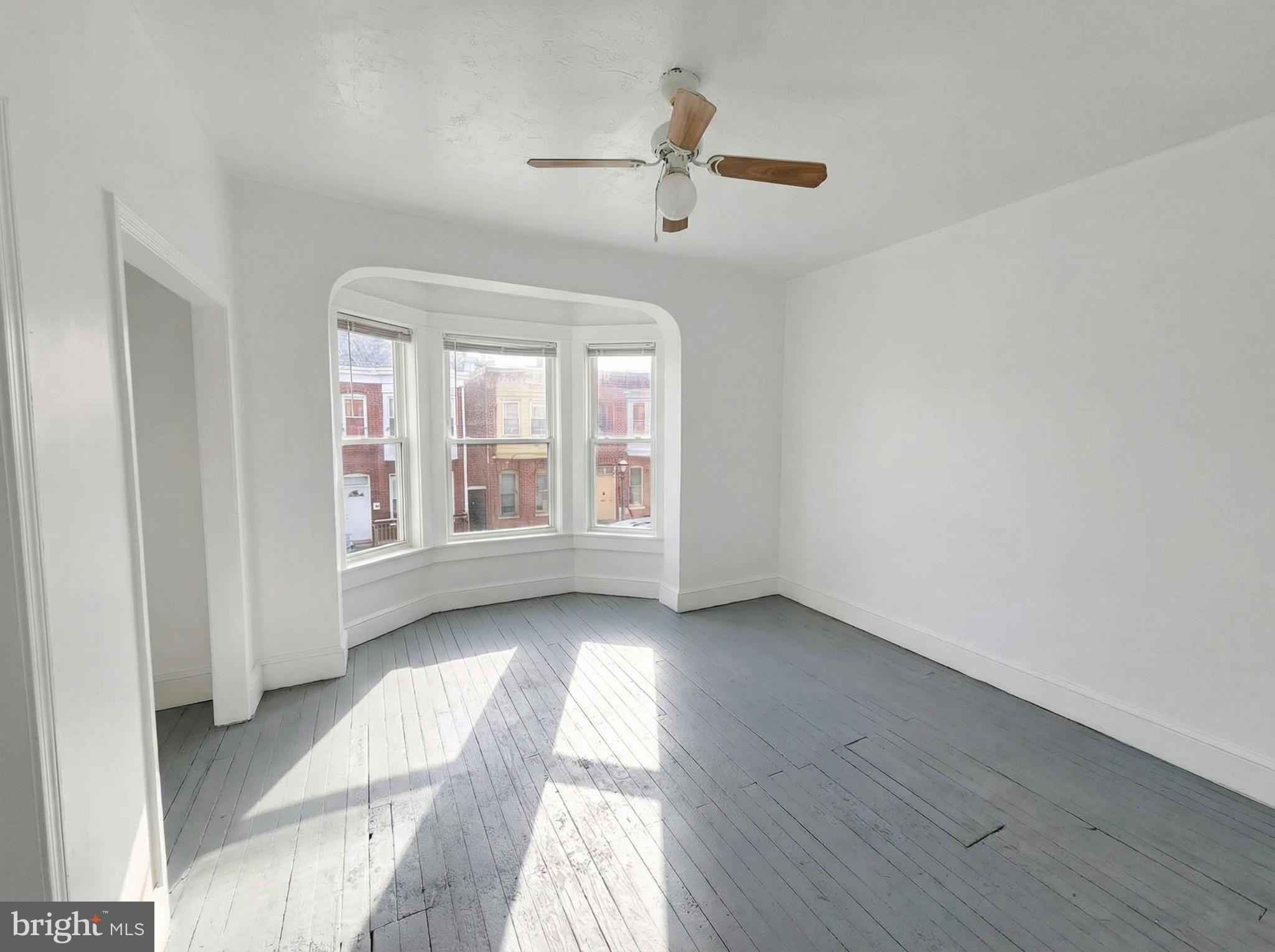 345 East Princess Street York, PA 17403 - Photo 9 of 14 a view of an empty room with a window and wooden floor