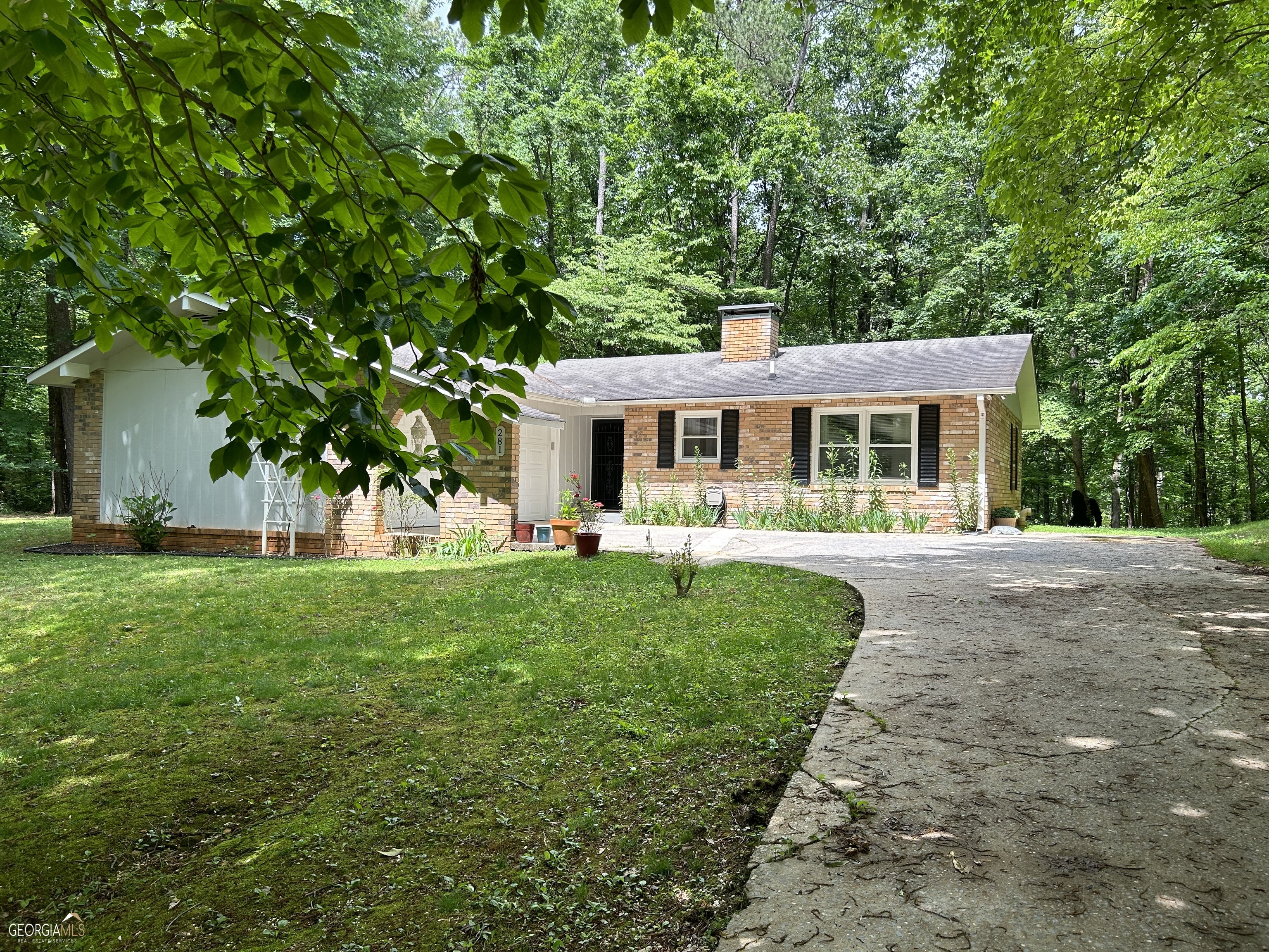 front view of a house with a yard