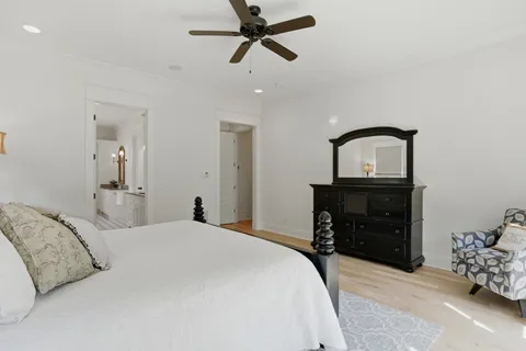 a bathroom with a sink a toilet and a shower