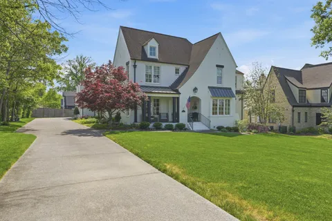 a front view of house with garden