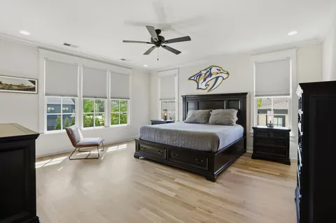 a bathroom with a granite countertop toilet a sink and a mirror