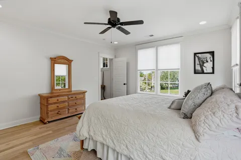 a bathroom with a granite countertop toilet sink and mirror
