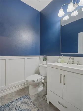 a bathroom with a sink toilet and vanity