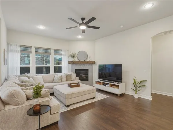 a large white kitchen with stainless steel appliances